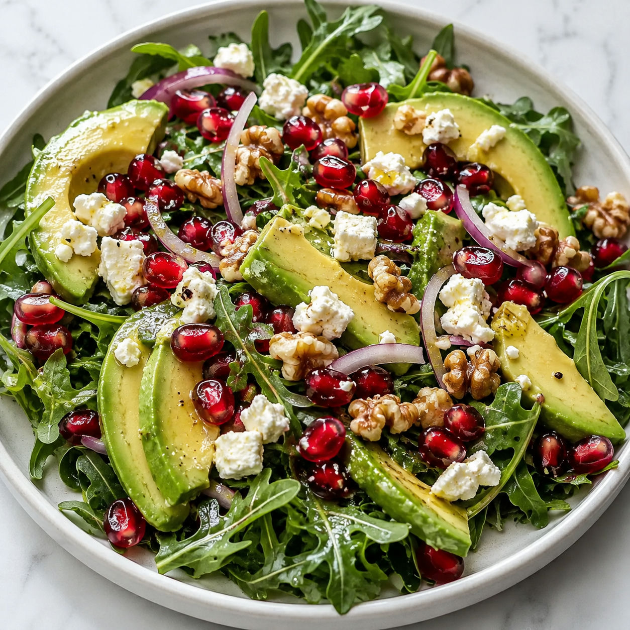 Avocado and pomegranate salad with feta, red onion and toasted walnuts